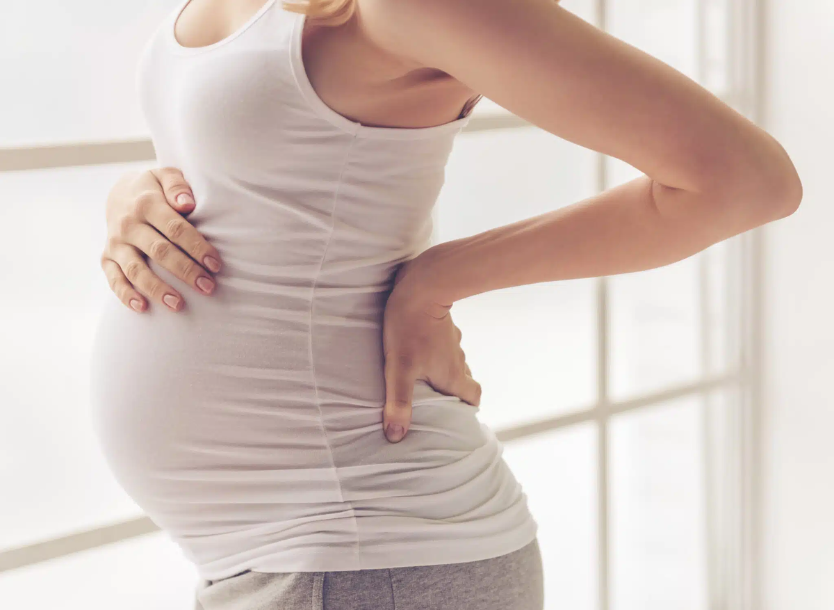 Боль в спине при беременности: причины, лечение и профилактика.